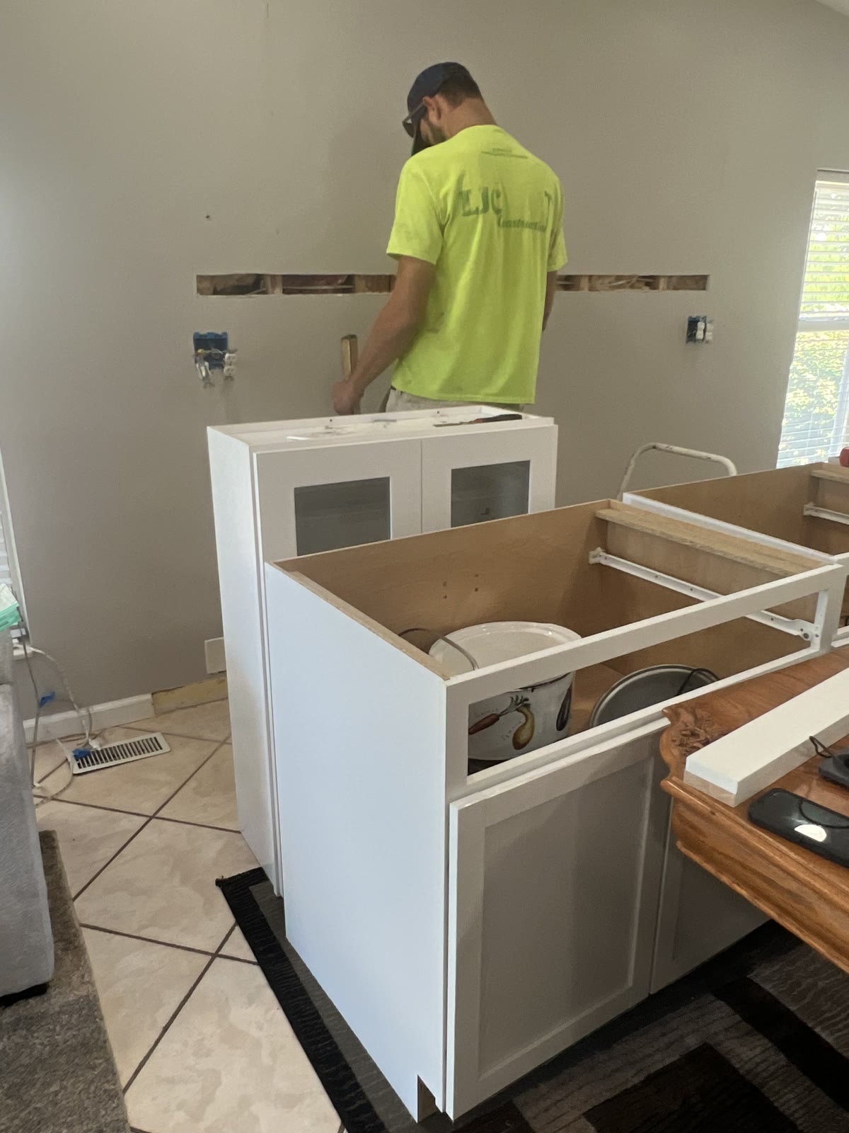 LJC crew installing white shaker kitchen cabinets