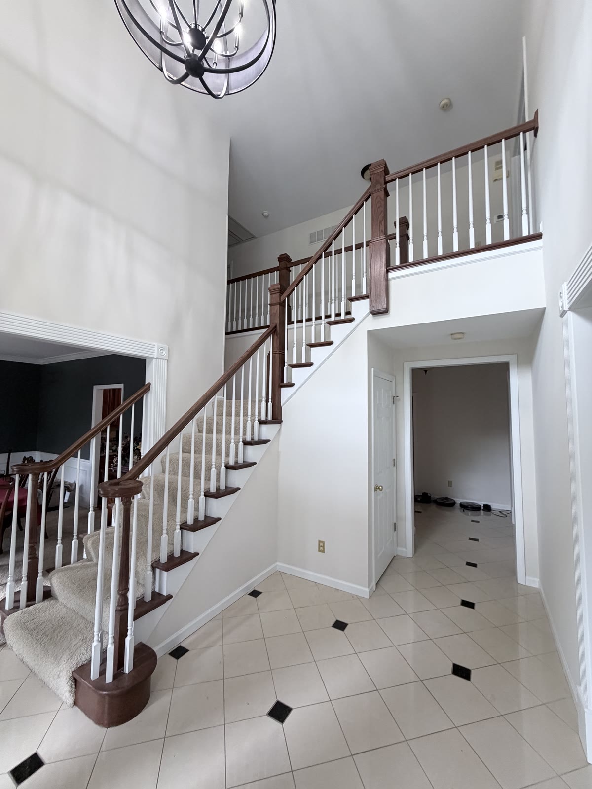Wood staircase with white spindles and freshly painted walls