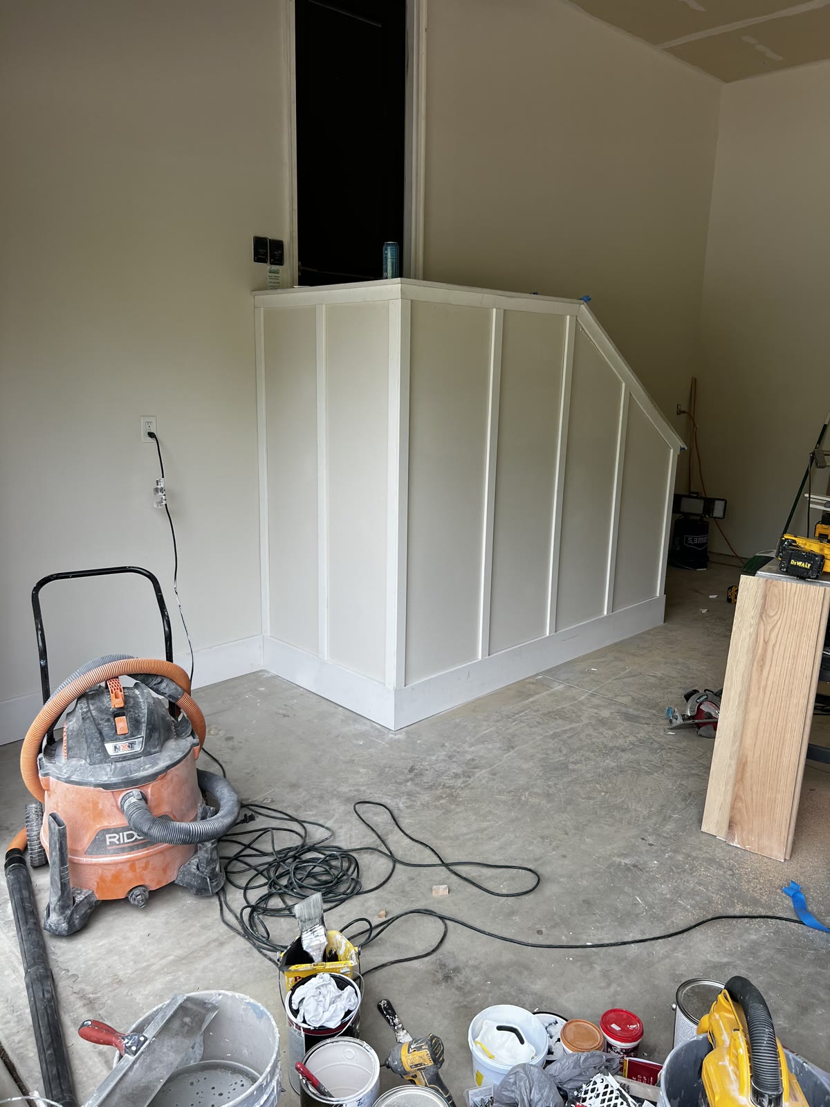 Under-stair shaker wainscoting installation in progress